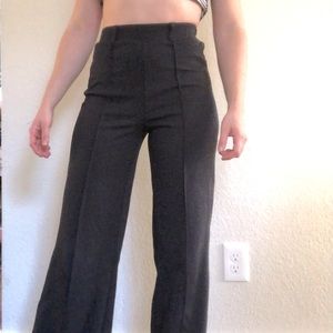 Black slacks with high waist and wide leg fit
